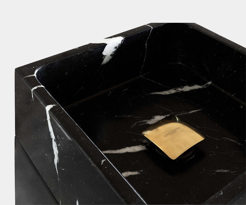 Contemporary marble bathroom sink with a Colosseum-inspired pedestal, featuring Nero Marquina marble and sleek lacquered finish.