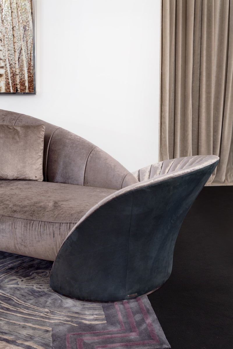 Modern Design with Timeless Comfort: The Presence Sofa. Visionnaire's masterpiece offers a captivating interplay of form and function. The asymmetrical design, luxurious upholstery, and customisable finishes create a modern statement piece that ensures exceptional comfort for any living space.