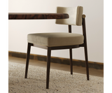 Sophisticated Frank dining chair with minimalist lines and elegant brass accents.