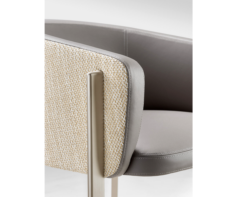 Versatile Ghidini 1961 Arch Chair complementing a chic dining area with contemporary design.