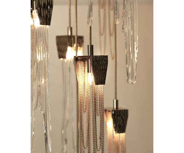 Opulent brass and crystal Empyrean Chandelier in a sophisticated living room.