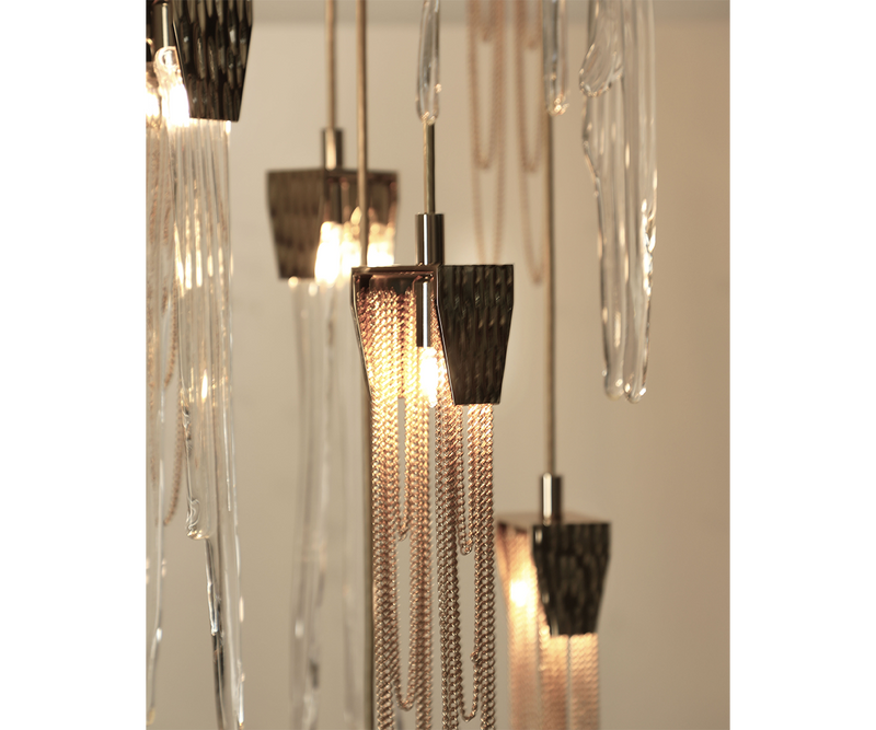 Opulent brass and crystal Empyrean Chandelier in a sophisticated living room.