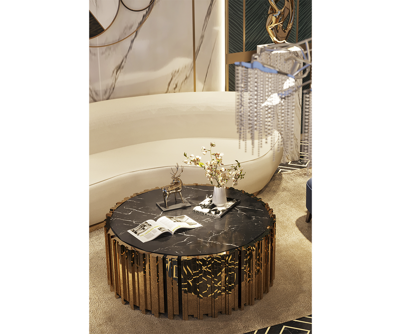 Nero Marquina marble center table styled with a designer vase and coffee table books for a luxurious living space.