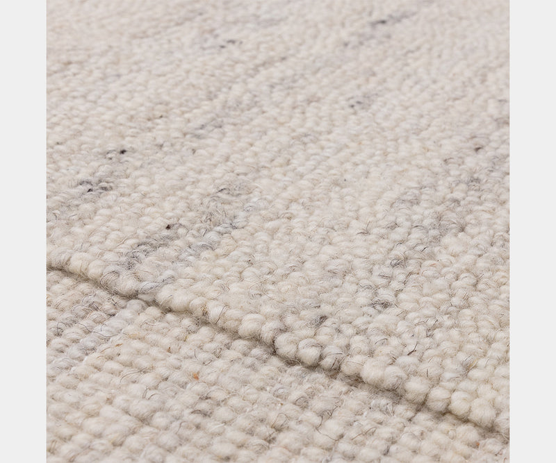 Larson Ivory wool rug perfect for Scandinavian-style luxury interior design.