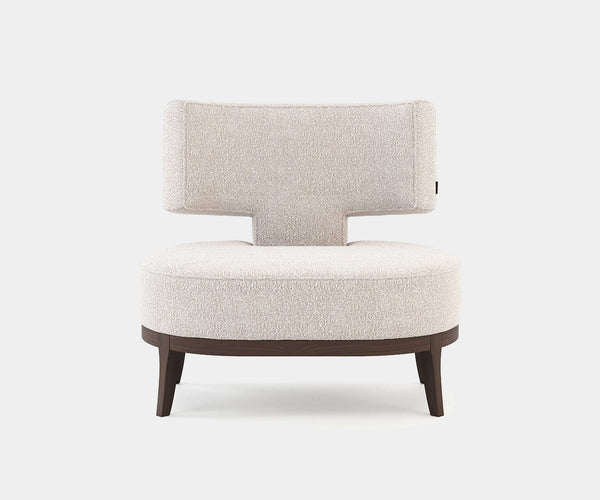 Tonic T Bouclé Armchair in Cream: Modern luxury embraces you in comfort. T-shaped design with soft bouclé fabric and walnut wood veneer legs.