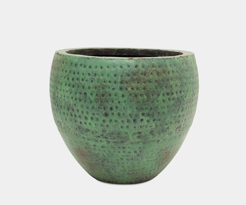 Vibrant turquoise vases with hammered texture for indoor and outdoor elegance.