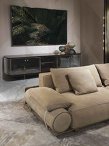 Leather Belt Detail Sofa: Visionnaire's Donovan Roll Sofa boasts a unique design element - two cylindrical upholstered armrests connected with leather belts and metal buckles. This modern detail adds a touch of visual interest to this luxurious sofa.