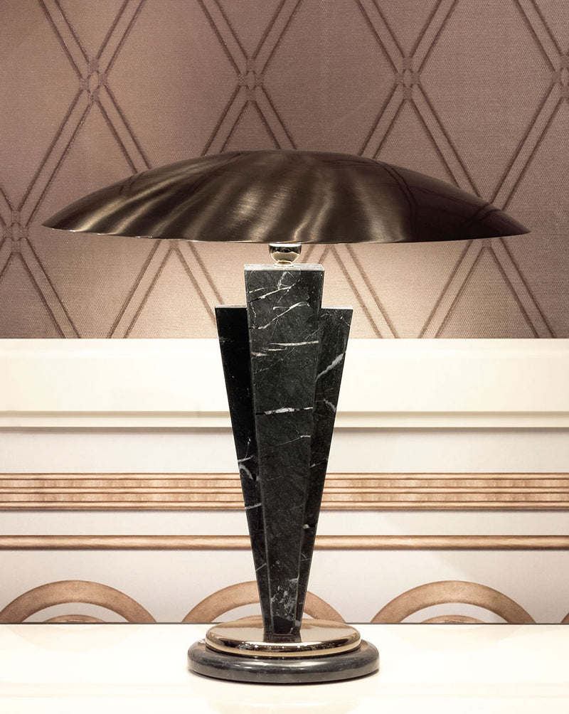 Luxury Marble Table Lamp: The Lydia Table Lamp by Visionnaire boasts a captivating wedge-shaped stem crafted from luxurious marble. This sculptural piece offers a touch of modern elegance to your living space.