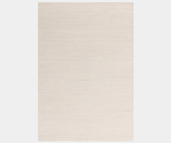 Zander Ivory luxury rug featuring a natural wave design for high-end home decor.