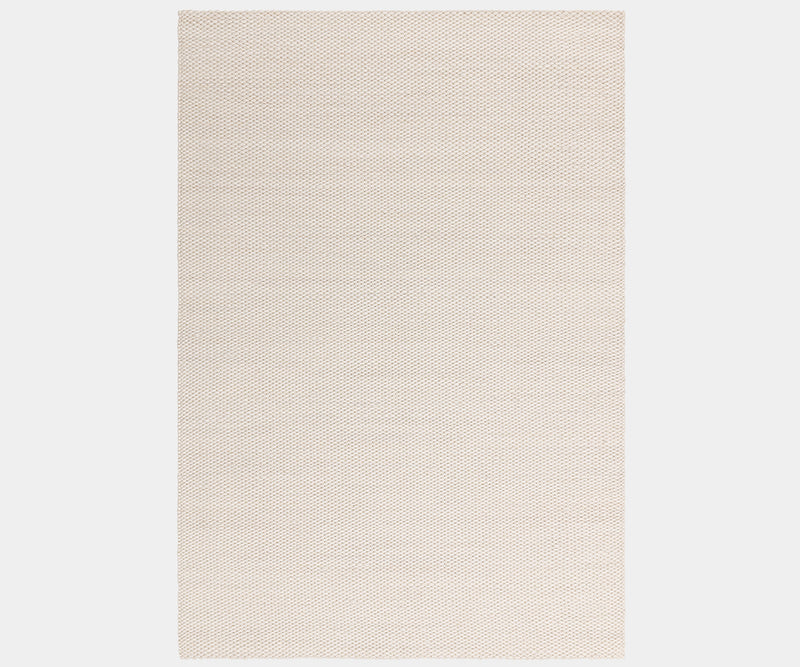 Zander Ivory luxury rug featuring a natural wave design for high-end home decor.