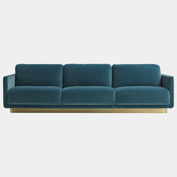 Daytona Haring Sofa showcasing luxury Italian design, featuring plush goose down cushions and a satin brass base, perfect for high-end living room furniture.