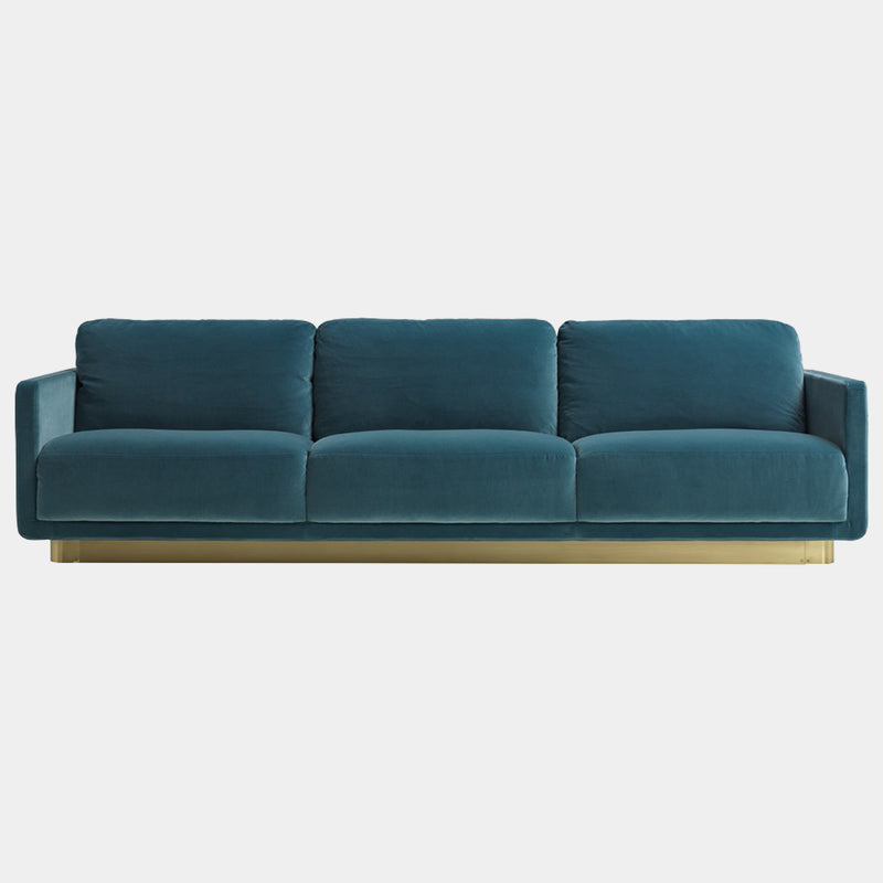 Daytona Haring Sofa showcasing luxury Italian design, featuring plush goose down cushions and a satin brass base, perfect for high-end living room furniture.